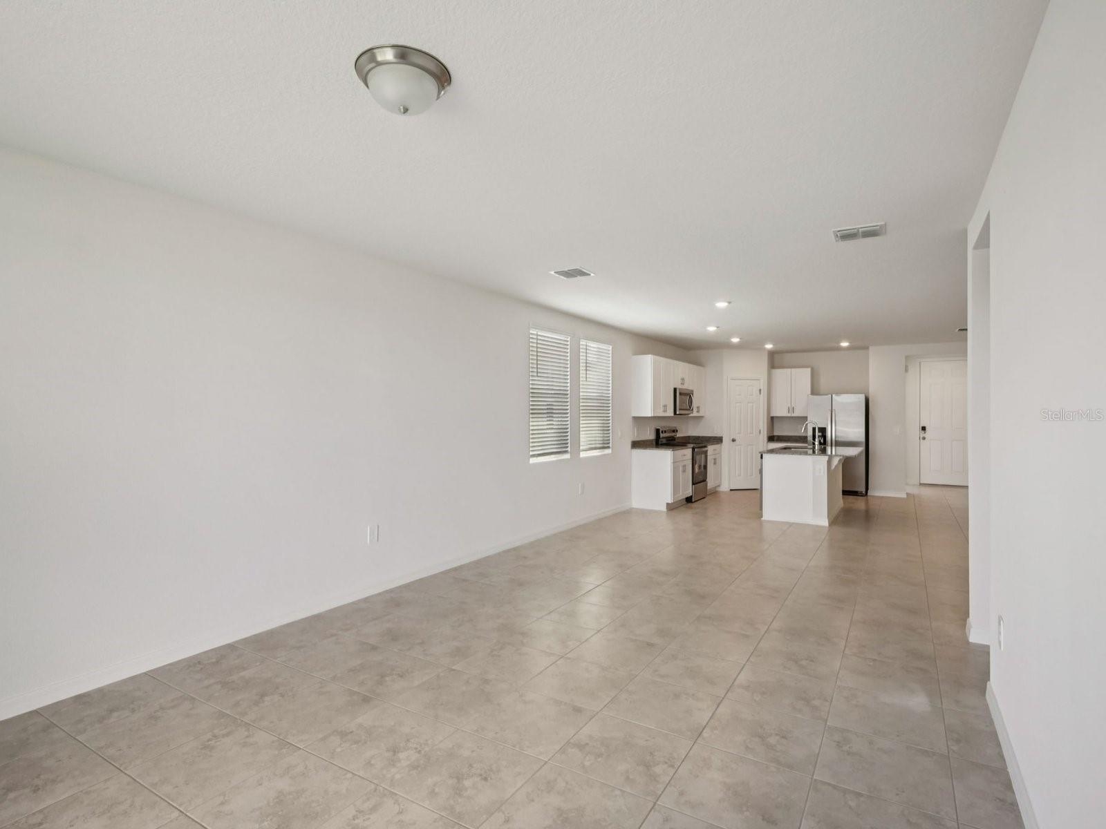 Can you make this description for VillaMar for MLS with a warm but sales appeal: This versatile floorplan offers four bedrooms, two full baths and family room, complemented by an open-concept kitchen, dining area, and great room designed for gathering and entertaining.