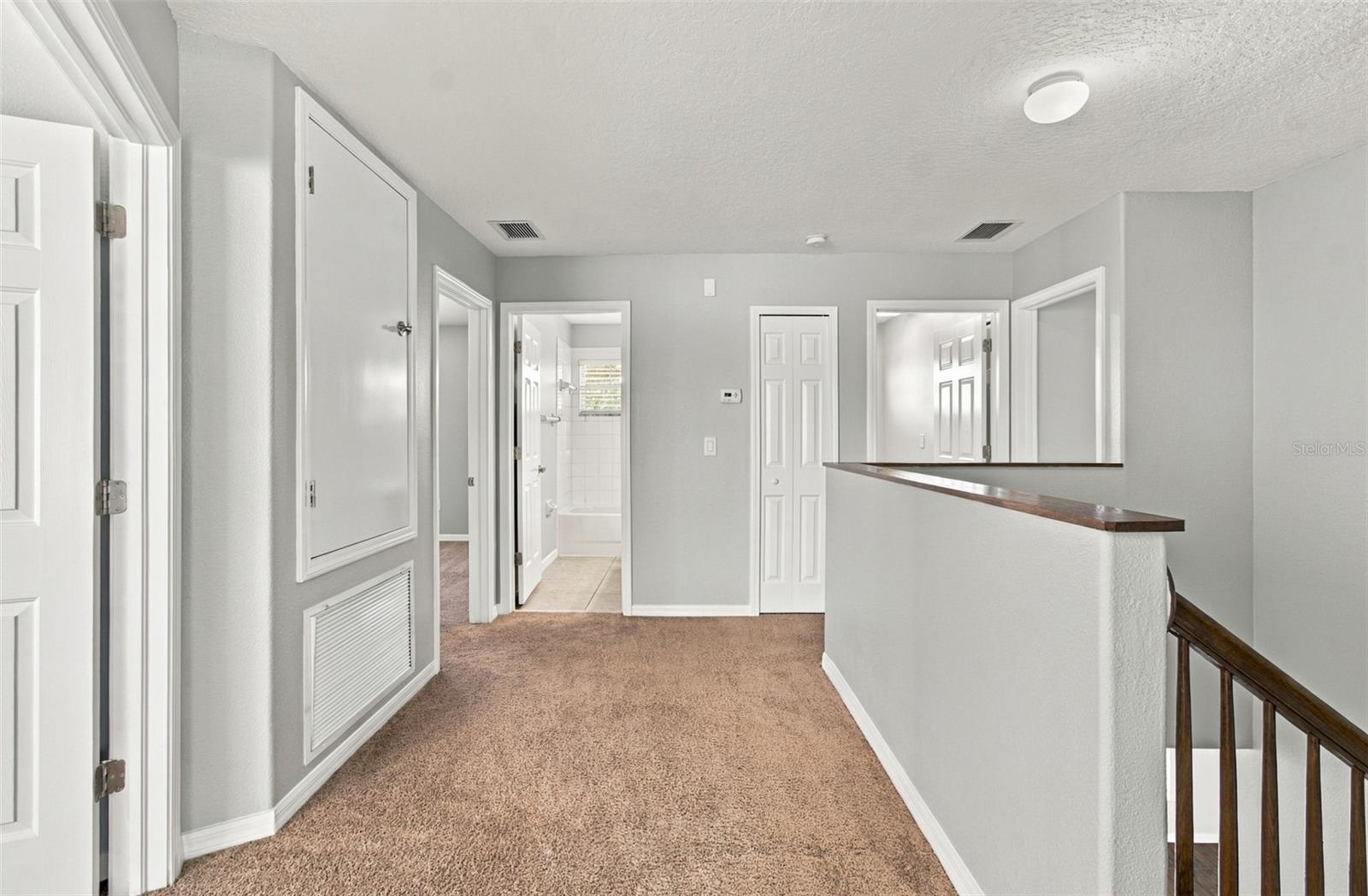 Upstairs Hallway to other bedrooms, Laundry Room. A/C C.oset