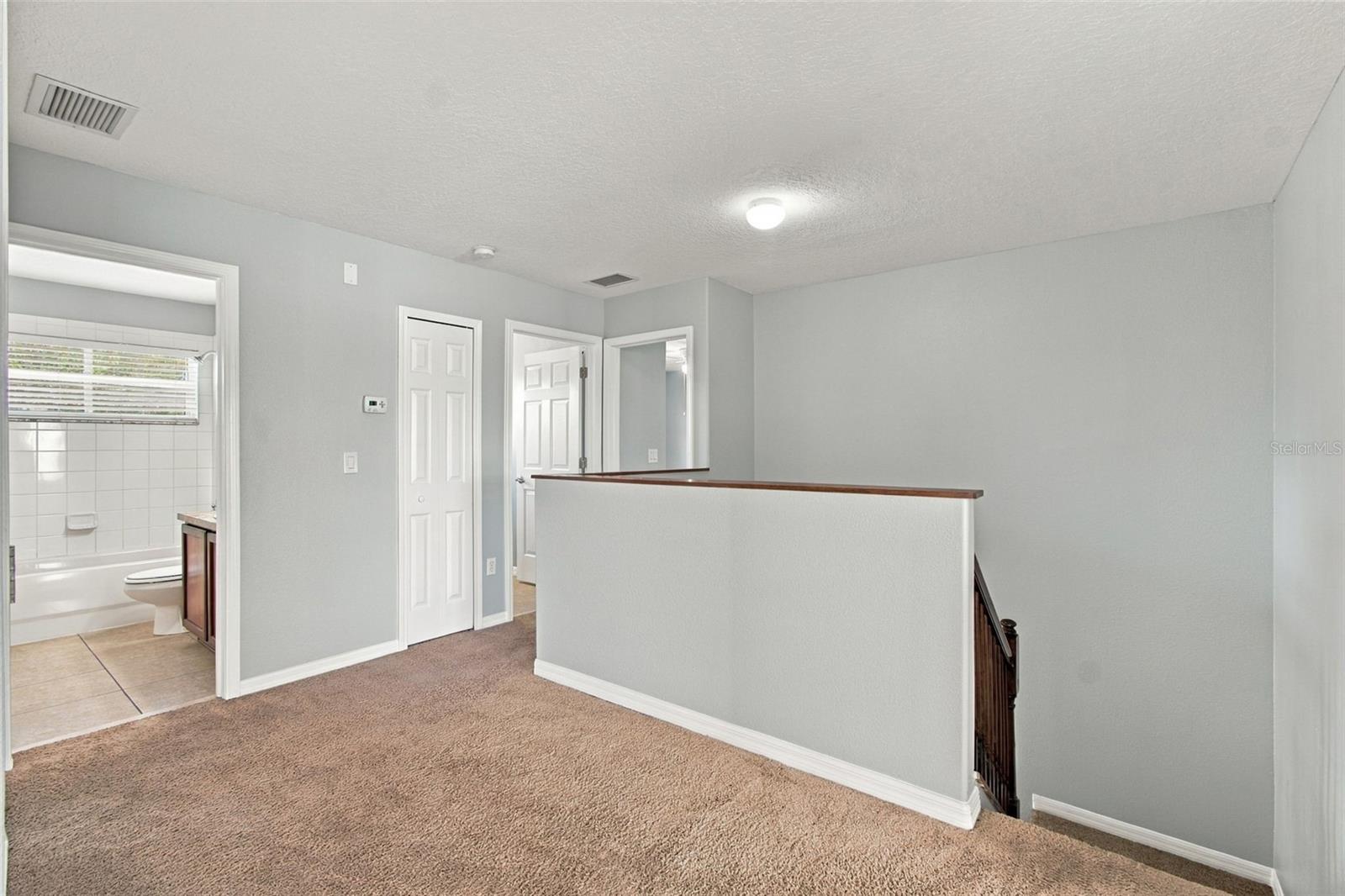 Upstairs Hallway to Hall Bath and Linen ZCloset