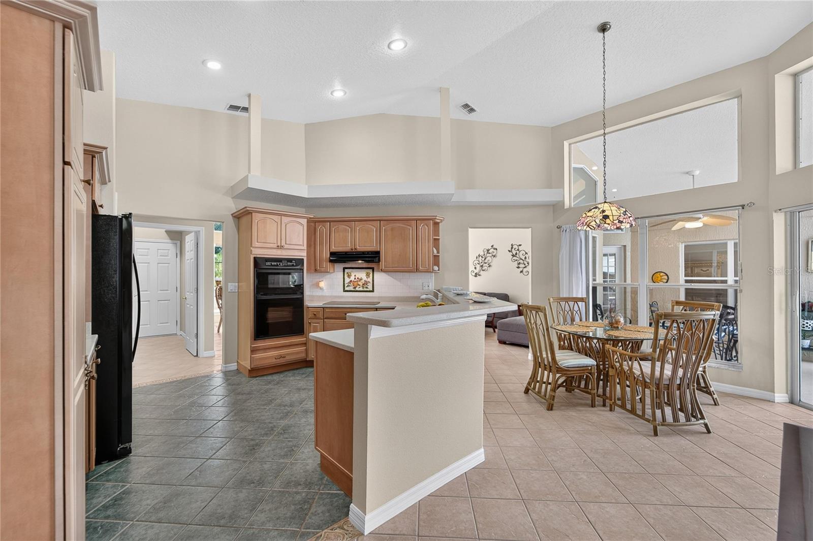 Kitchen look over the pool area and has alot of light