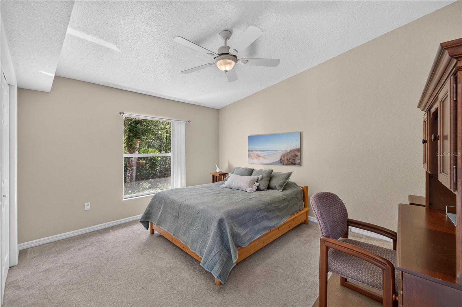 Guest room has an overhead fan