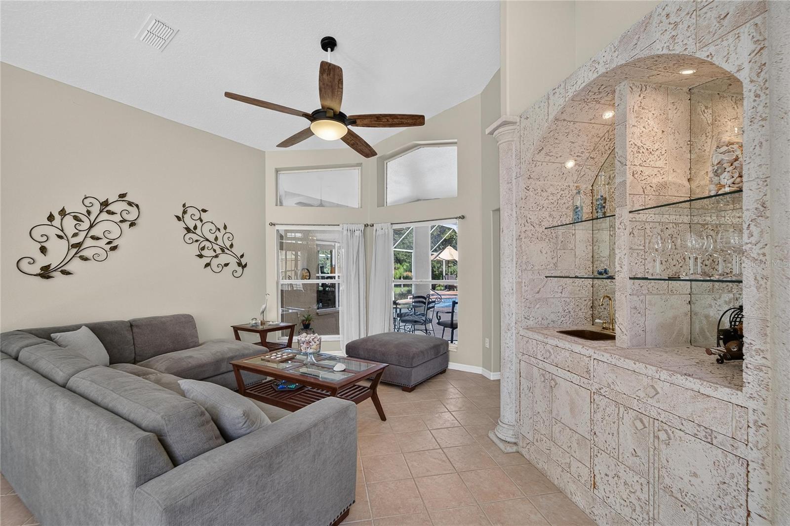 Formal living room looks over the pool
