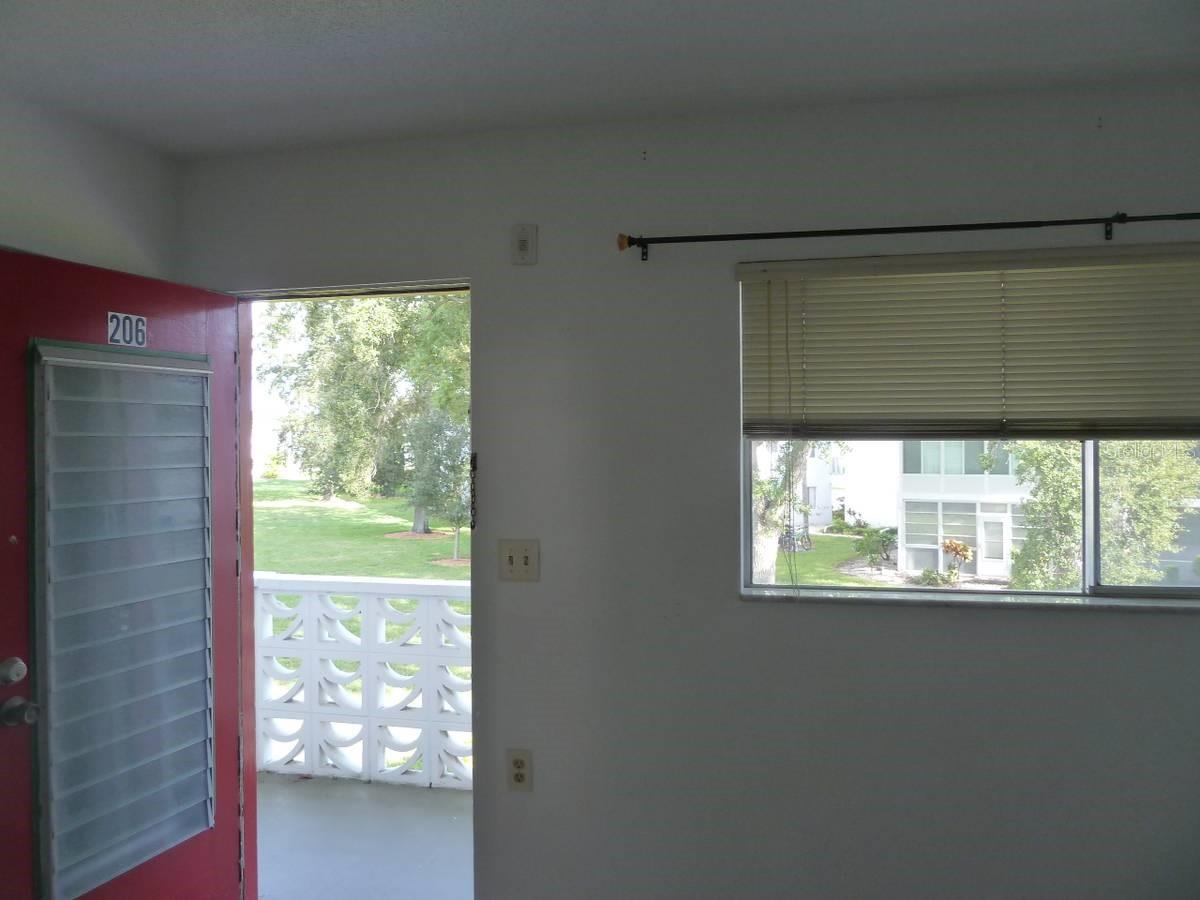 Bedroom exterior door to balcony overlooking parkway