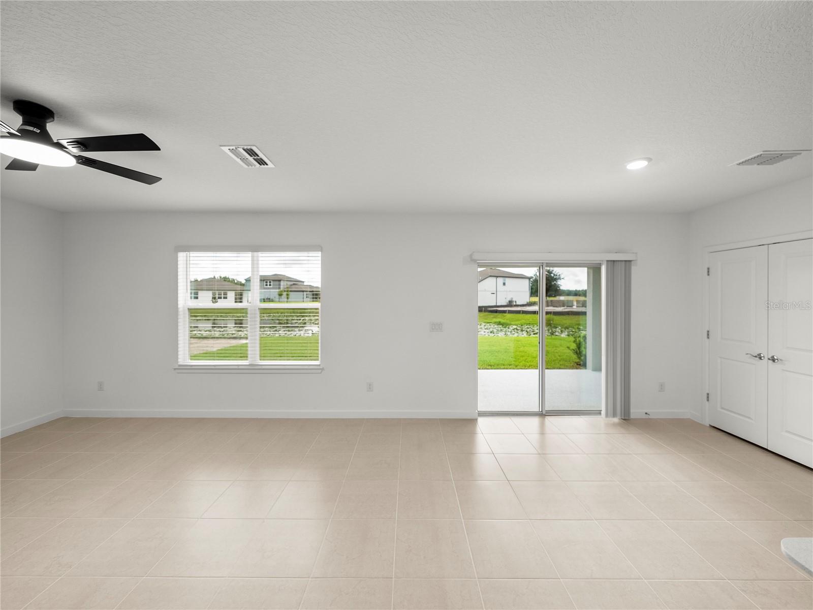 Large Open Living and Dining area with New LED Ceiling Fan & Convenient Floor Outlet