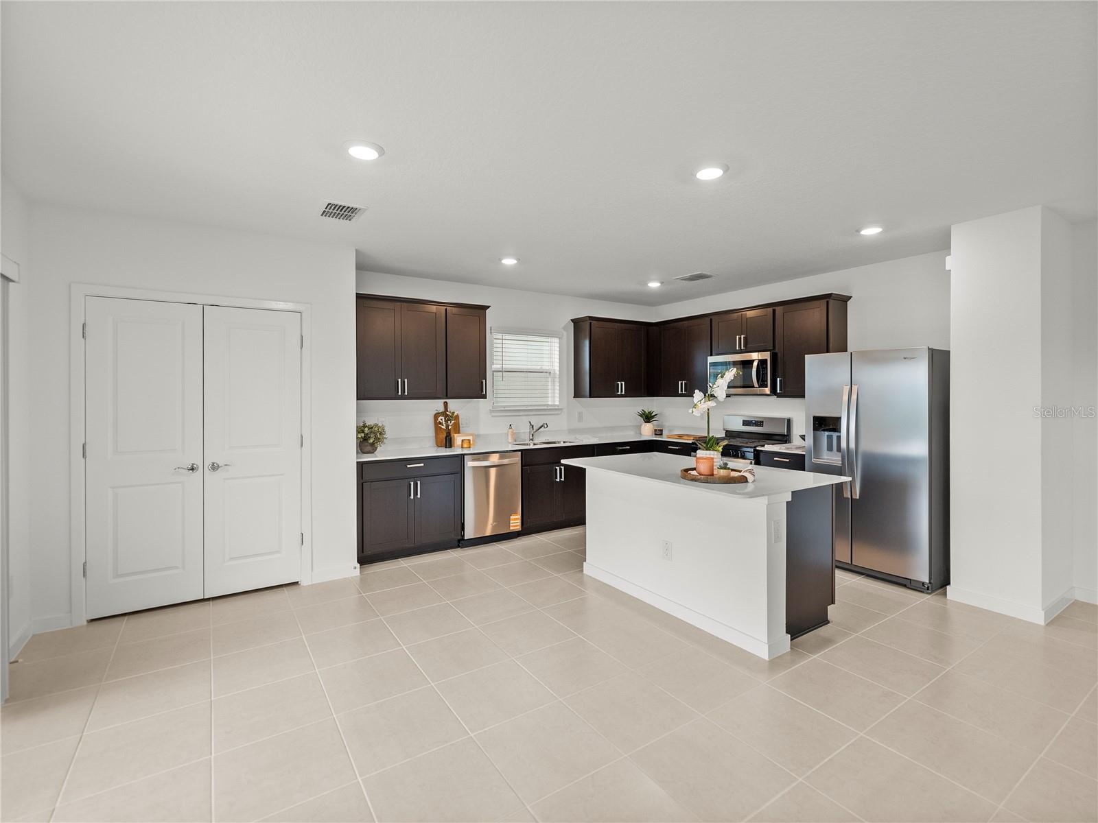 Upgraded Kitchen with Wood Cabinets, Upgraded Stainless Steel Appliance Package, All New Hardware & Quartz Countertops Upgraded Kitchen with Wood Cabinets, Upgraded Stainless Steel Appliance Package, All New Hardware & Quartz Countertops