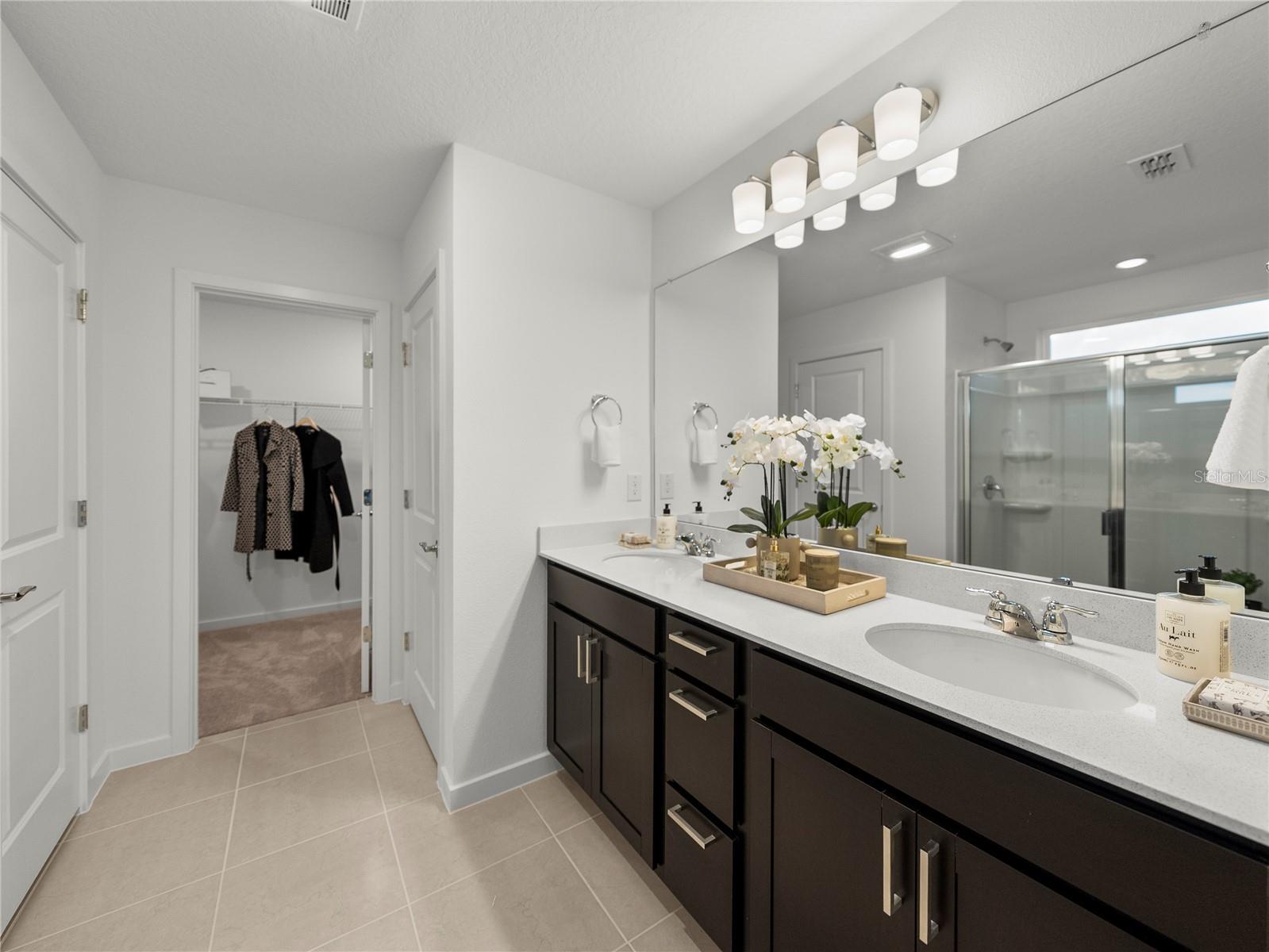 Primary Bath with Quartz Countertops, Extended Vanity w/Drawers, Large Walk in Linen Closet & Walk in Closet & Toilet Room
