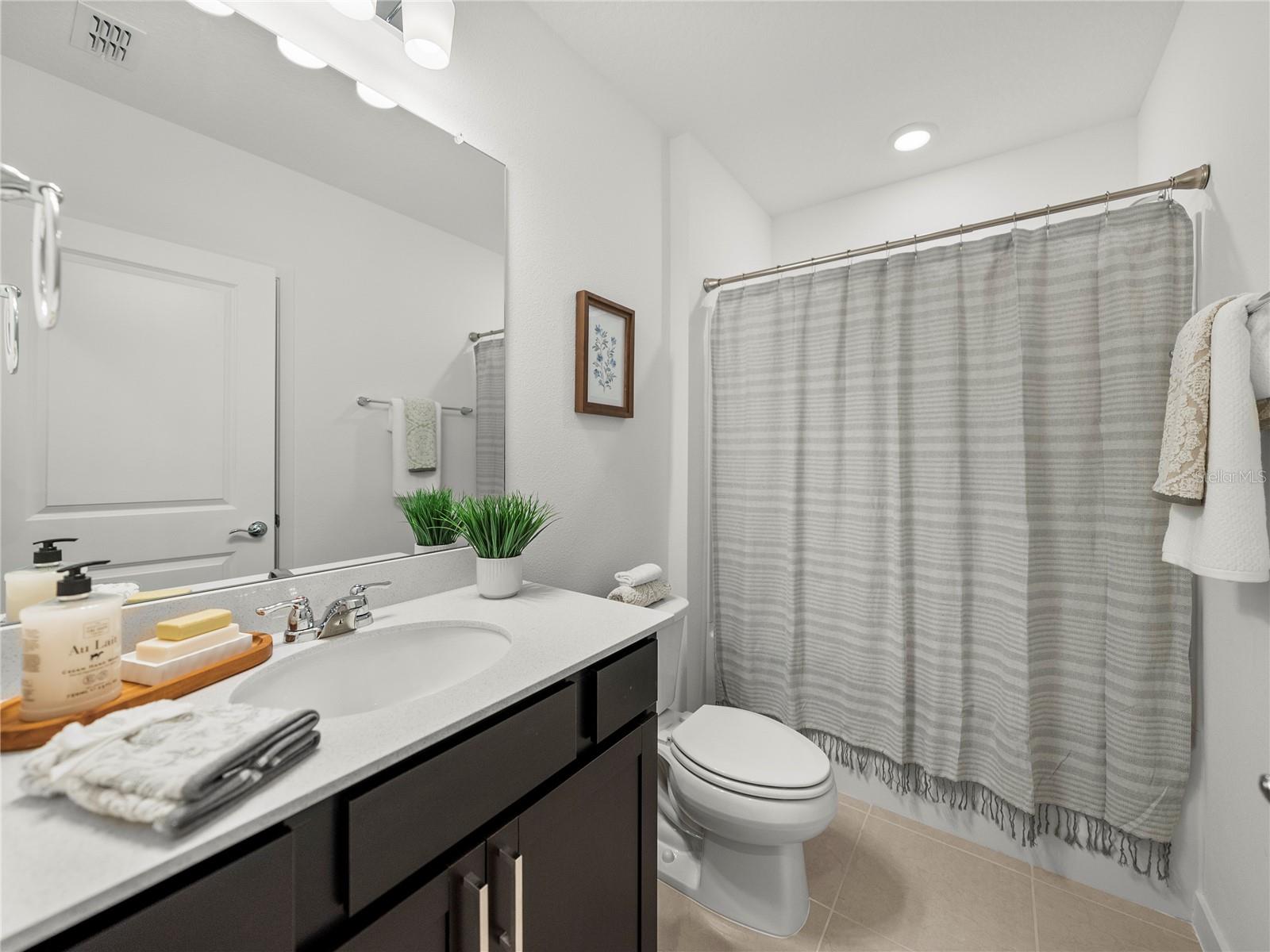 Downstairs Full Bathroom with extended Vanity