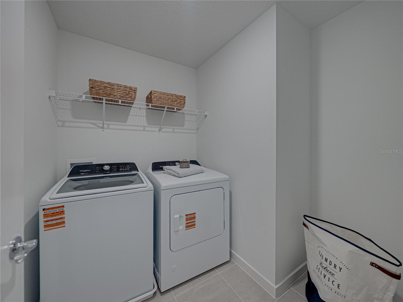Large Laundry Room with Storage Shelving and Extra Bump out area
