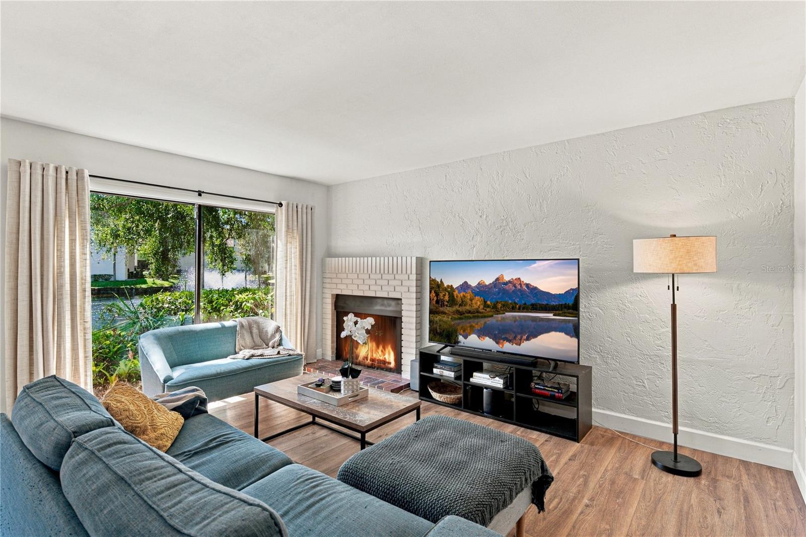 Charming Living Room Area with Beautiful Wood Burning Fireplace