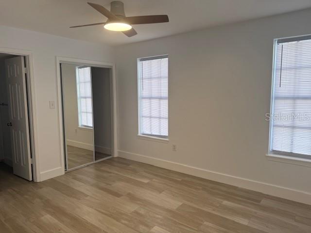 Primary bedroom with walk-in closet