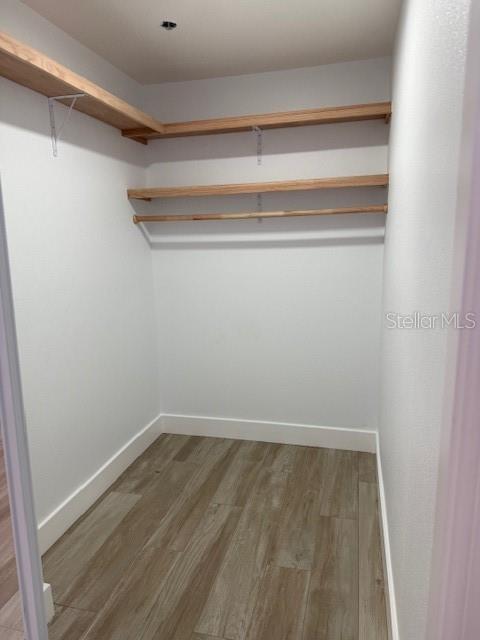 Primary bedroom walk-in closet