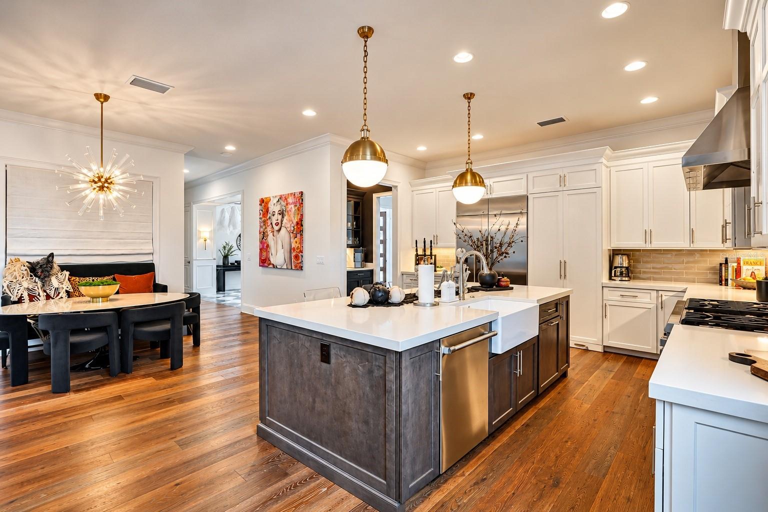 Kitchen -hidden walk-in pantry doors next to refrigerator