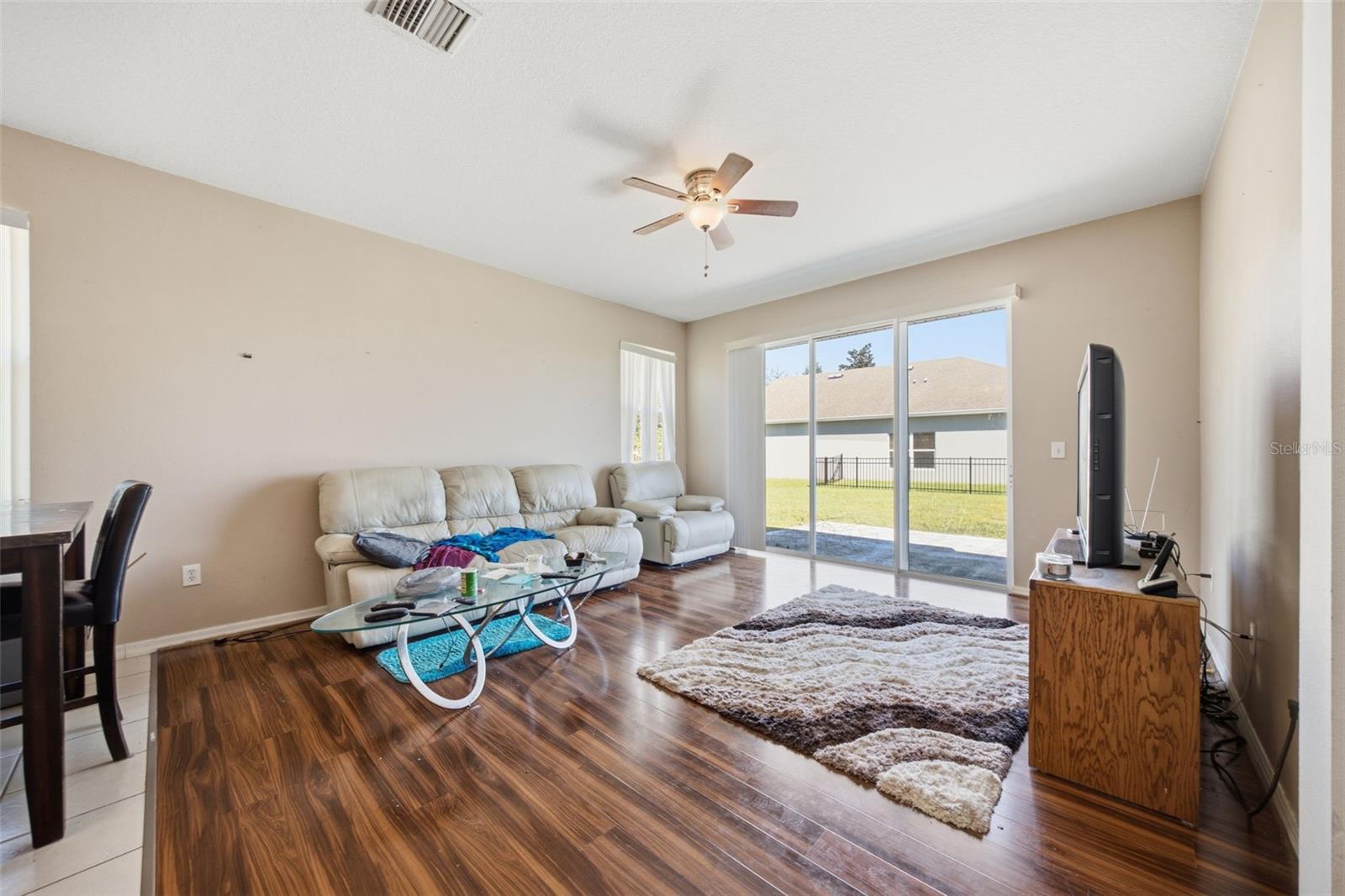 Family room with sliding glass doors to rear patio and yard