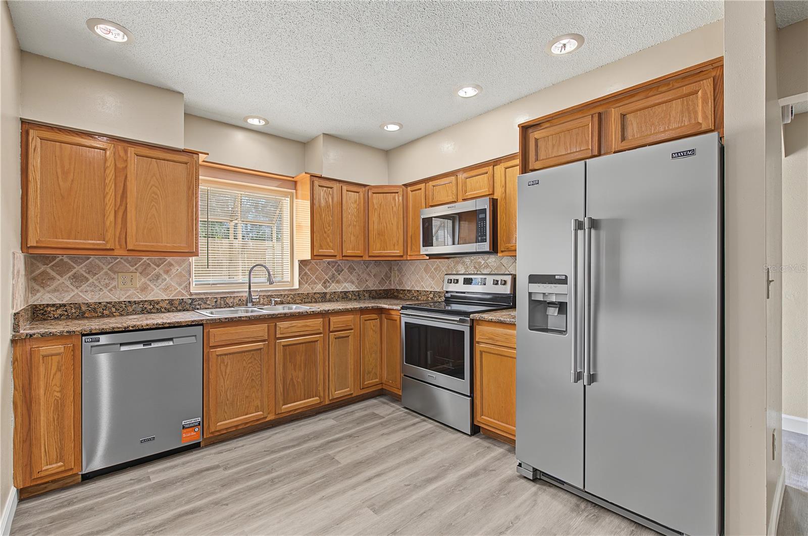 Stainless Steel Appliances, Patio off to the side.