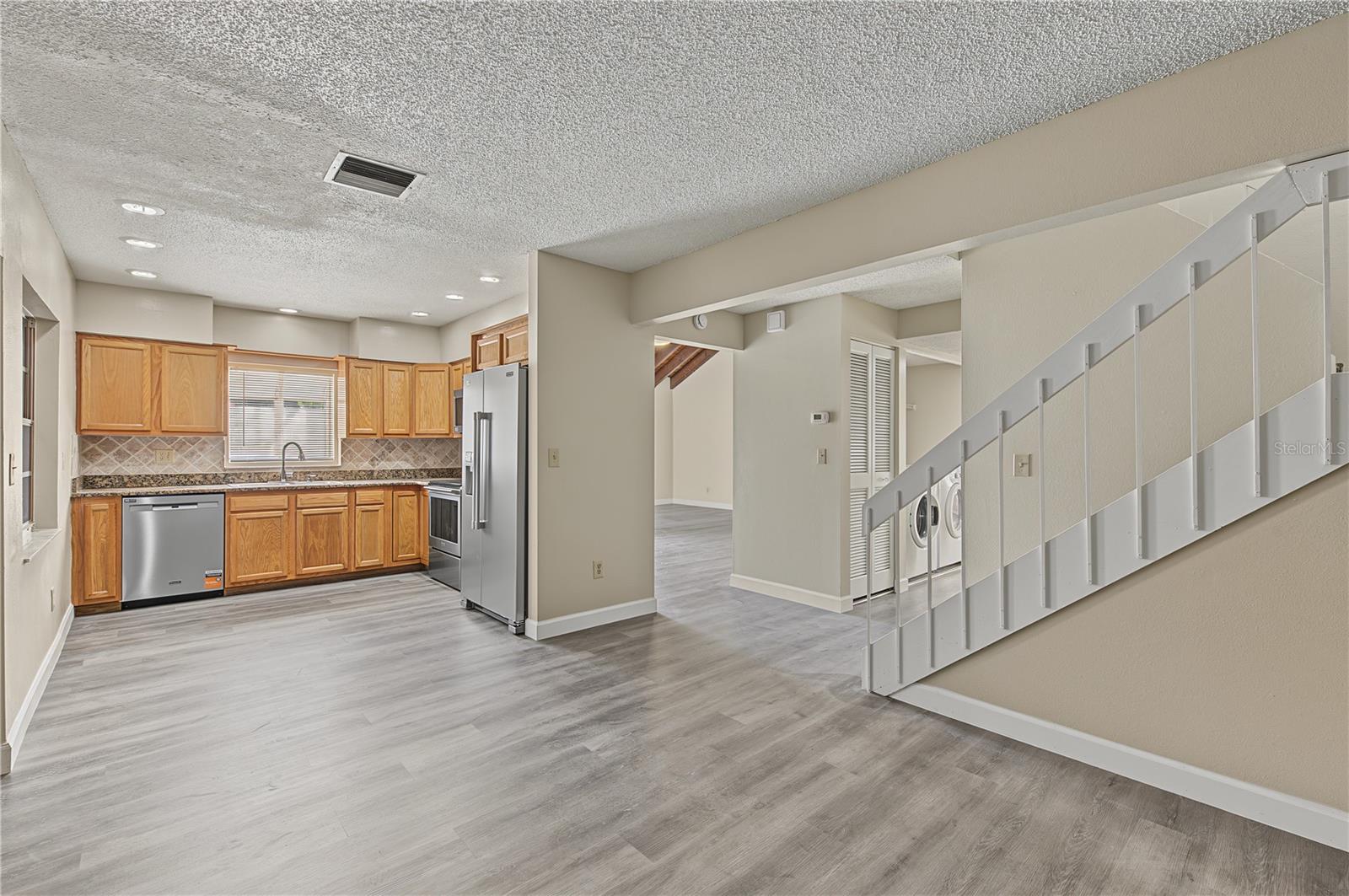 Stainless Steel Appliances, Patio off to the side, Laminate Flooring