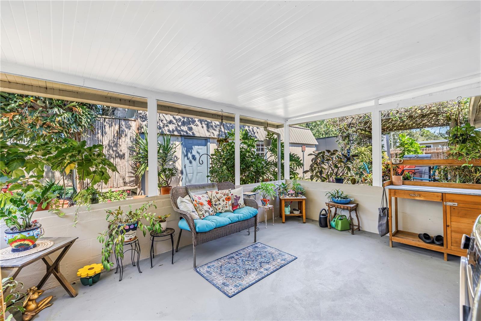 Peaceful covered back porch right out of the kitchen