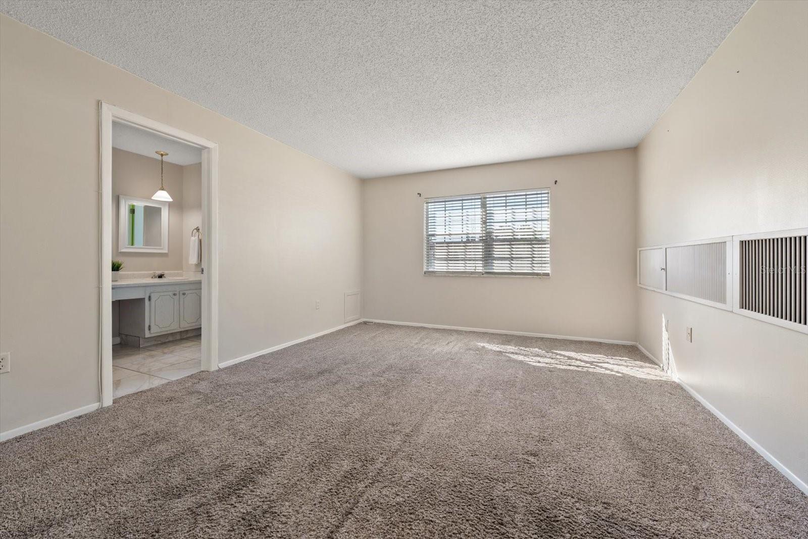Primary suite with additional closet, en suite bath and walk in closet