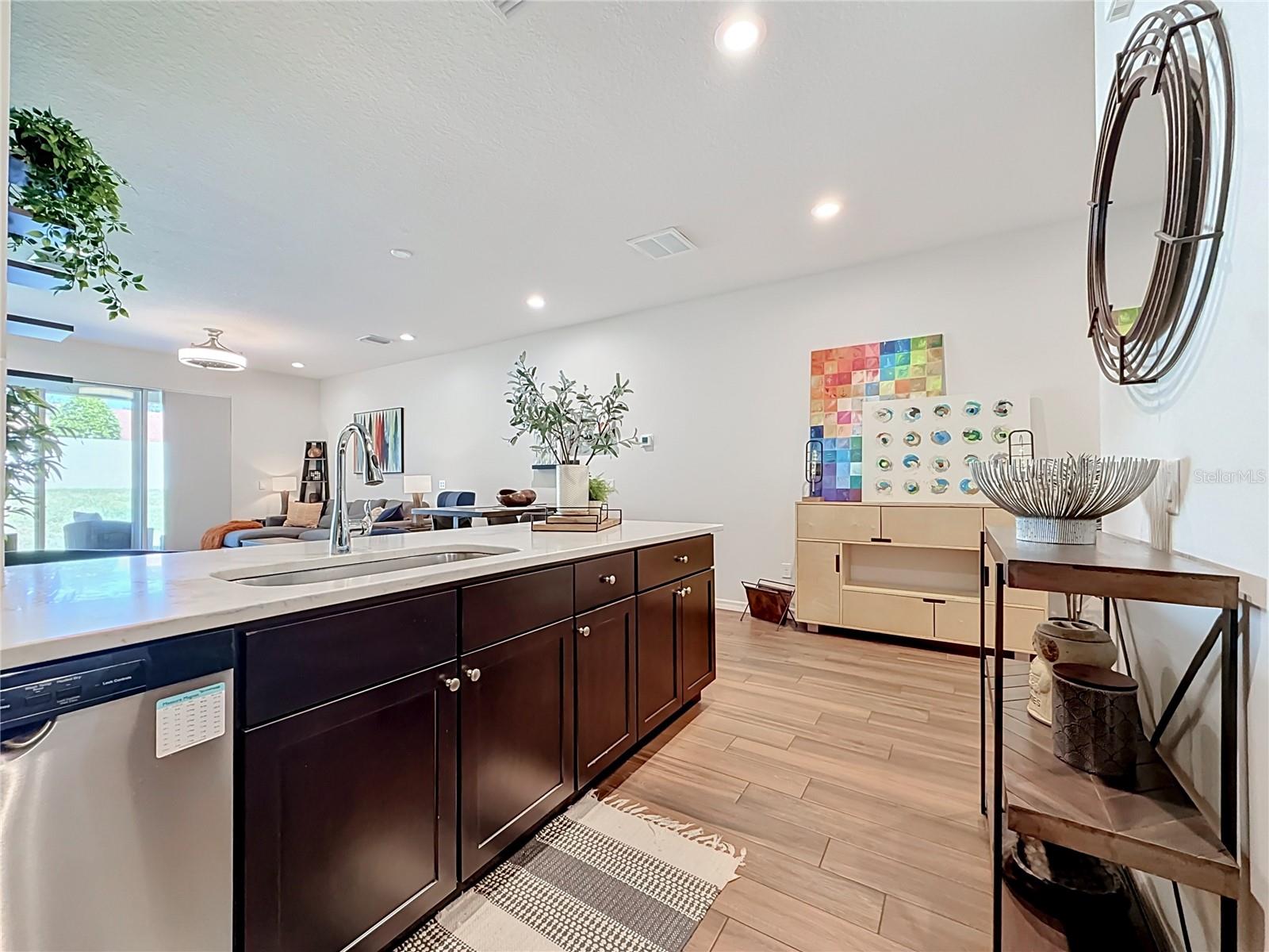The seamless flow between the kitchen, living, and dining areas makes entertaining a breeze