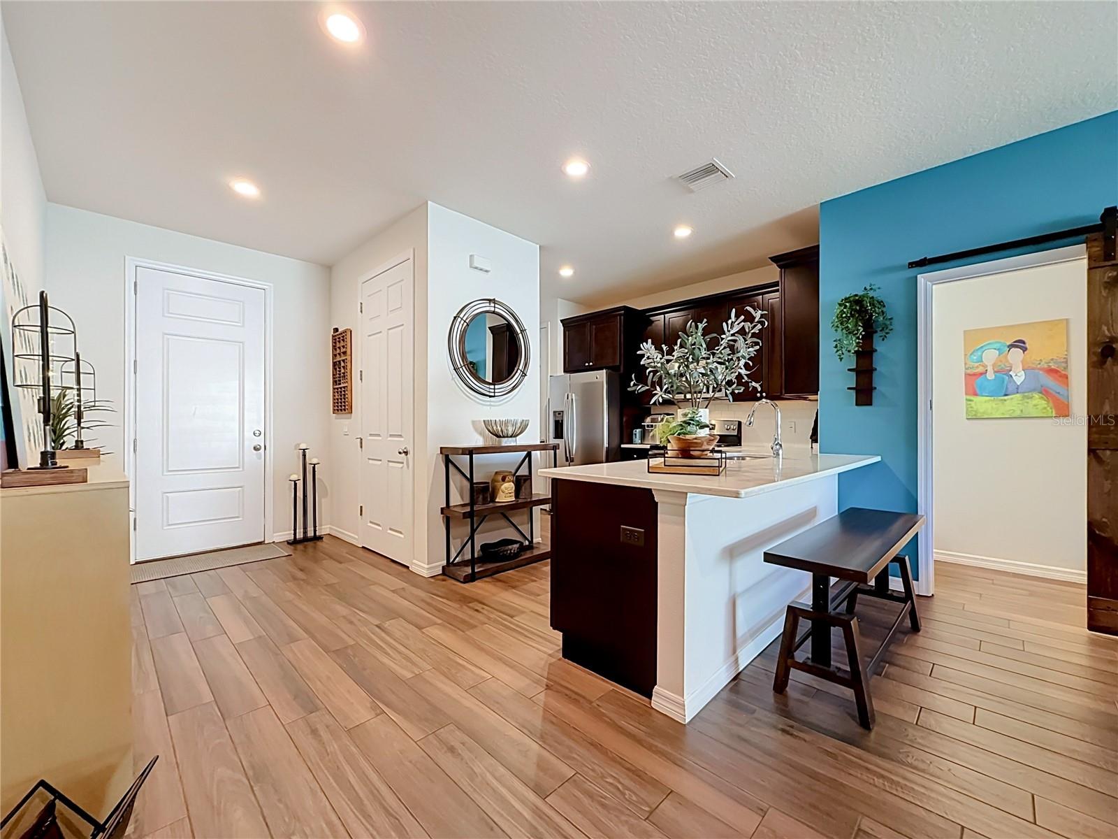 Step inside to discover a spacious OPEN FLOOR PLAN with soaring ceilings and beautiful WOOD-LOOK TILE flooring throughout the downstairs living areas. Step inside to discover a spacious OPEN FLOOR PLAN with soaring ceilings and beautiful WOOD-LOOK TILE flooring throughout the downstairs living areas.