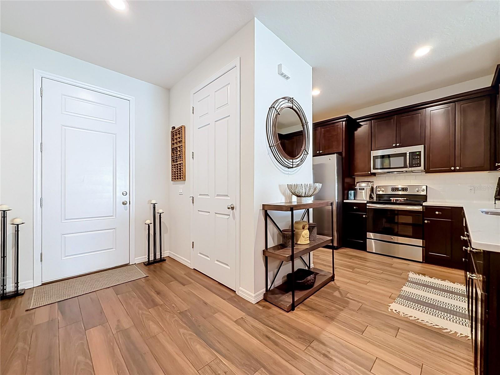 Step inside to discover a spacious OPEN FLOOR PLAN with soaring ceilings and beautiful WOOD-LOOK TILE flooring throughout the downstairs living areas. Step inside to discover a spacious OPEN FLOOR PLAN with soaring ceilings and beautiful WOOD-LOOK TILE flooring throughout the downstairs living areas.