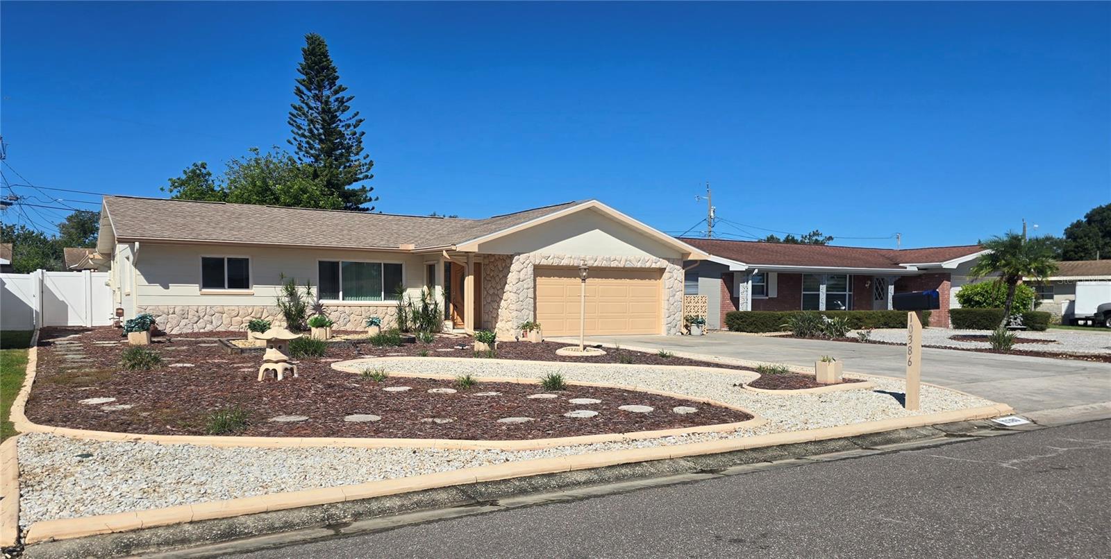 This home features a huge driveway and a maintenance free yard This home features a huge driveway and a maintenance free yard
