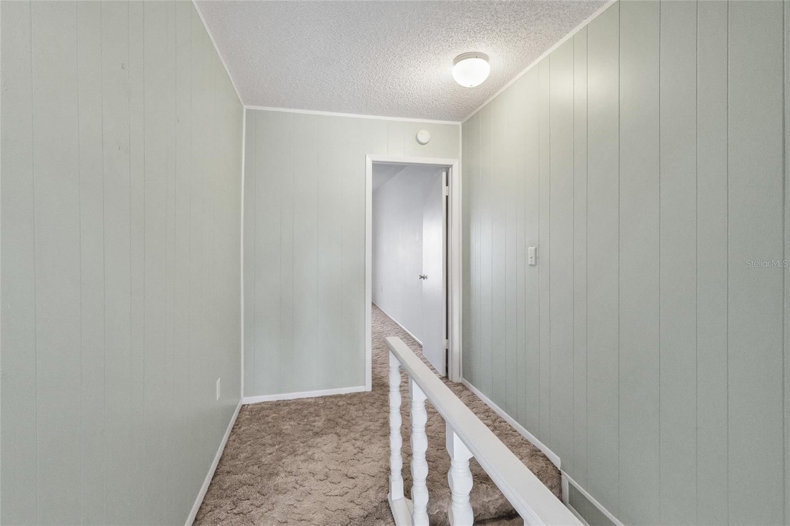 Stairway looking toward primary suite