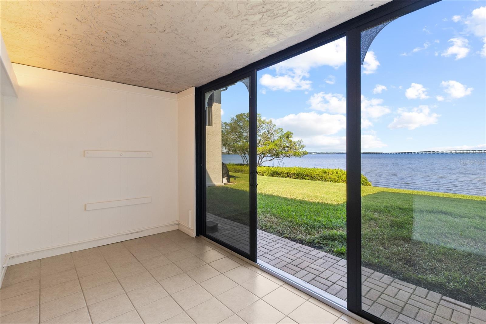 Sunroom with direct water views