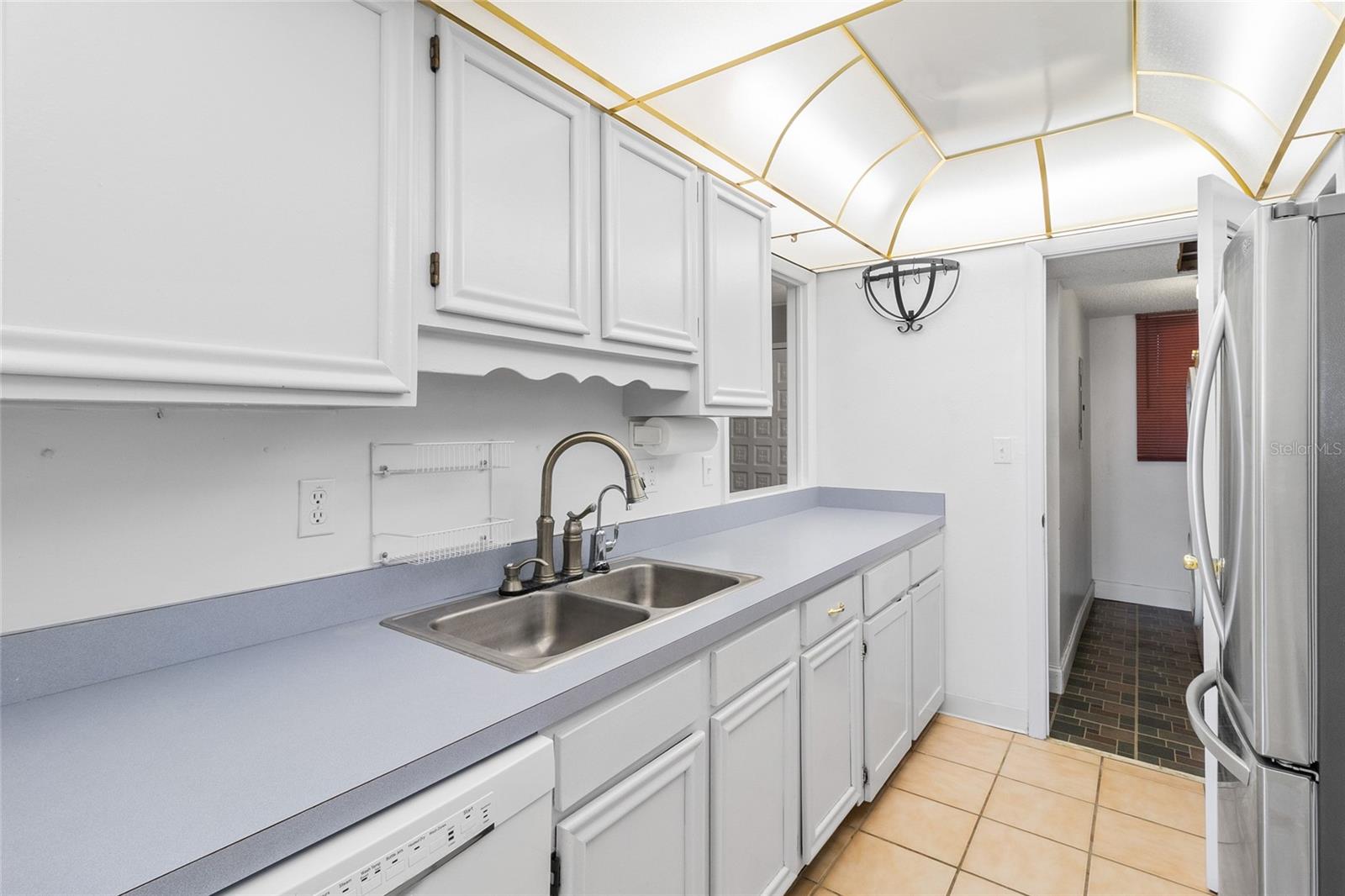 Kitchen looking toward interior laundry room