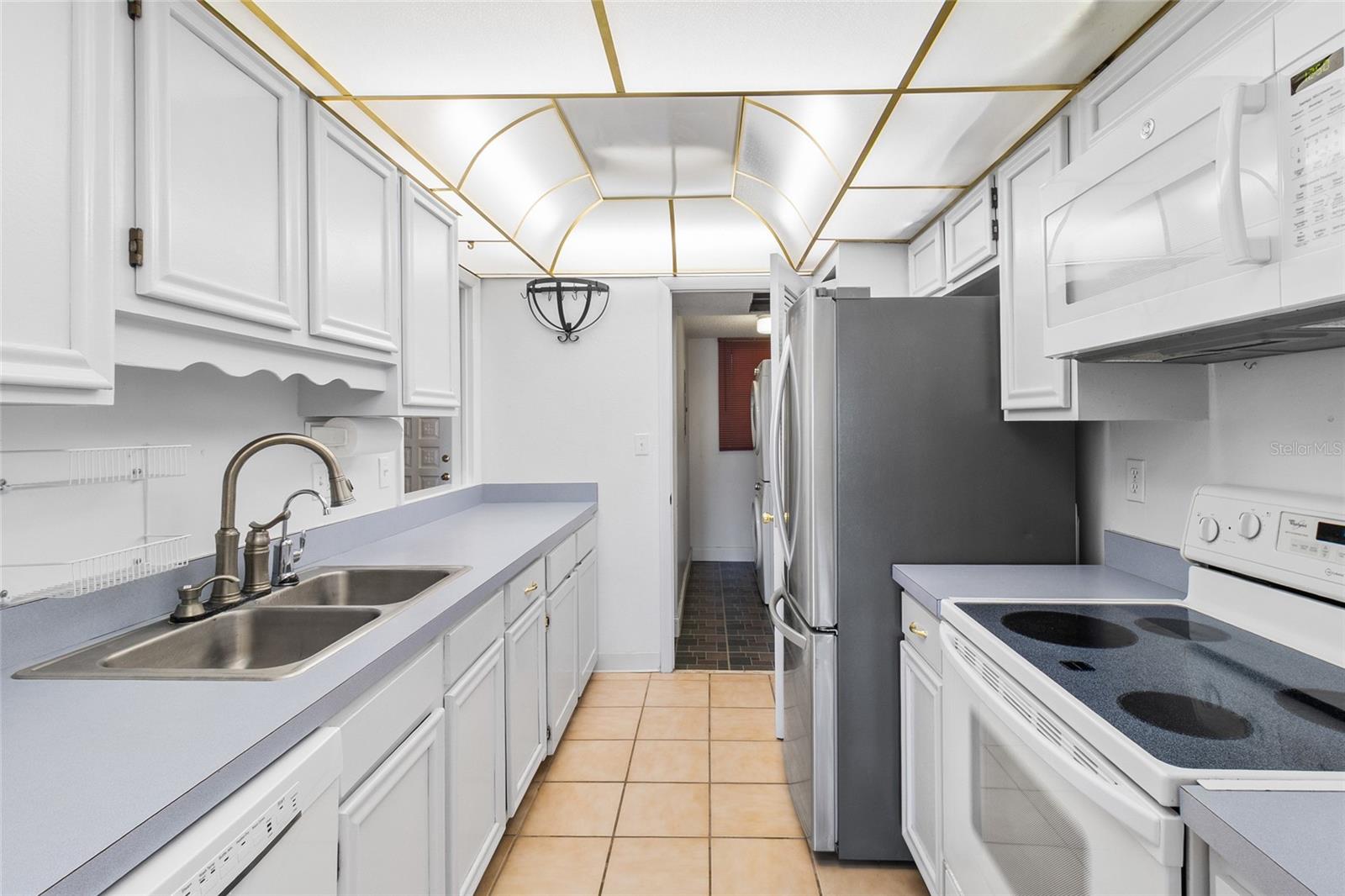 Kitchen looking toward interior laundry room