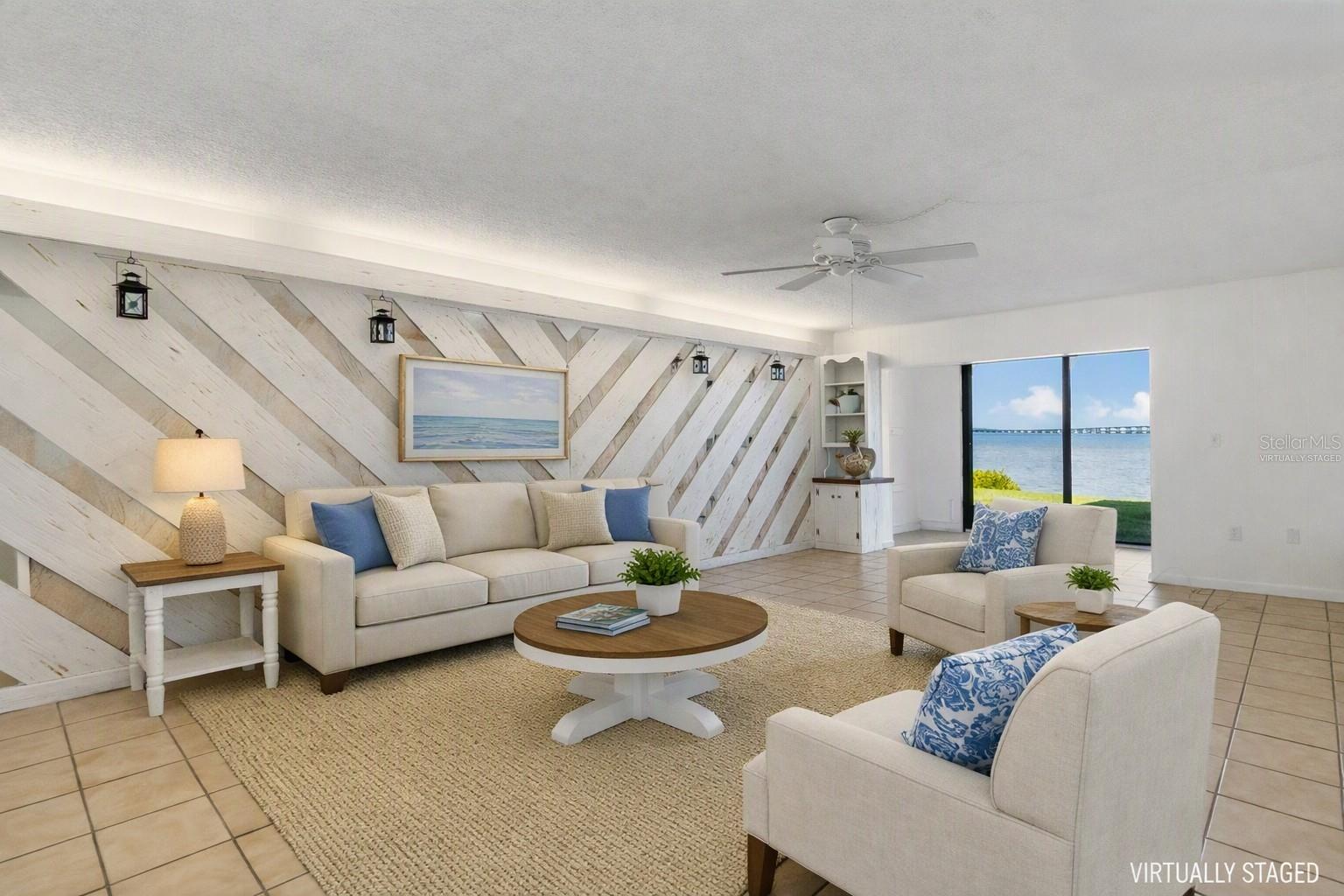 Virtually staged living area over looking water view