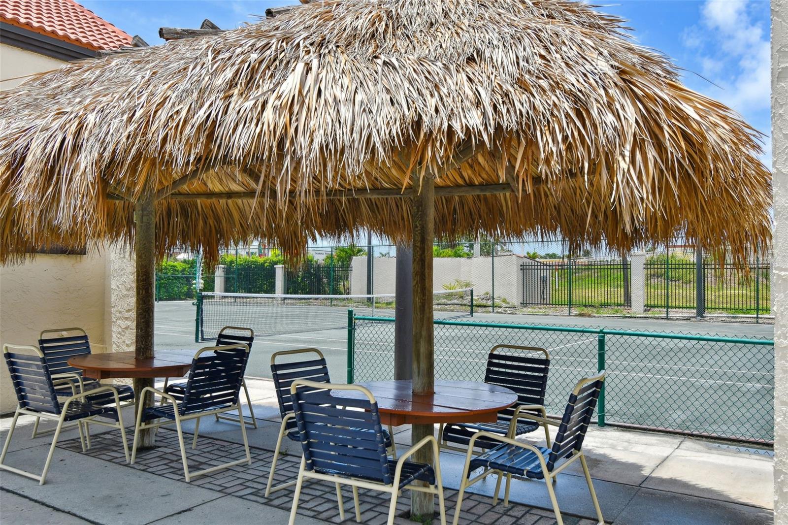 Tiki hut by tennis courts