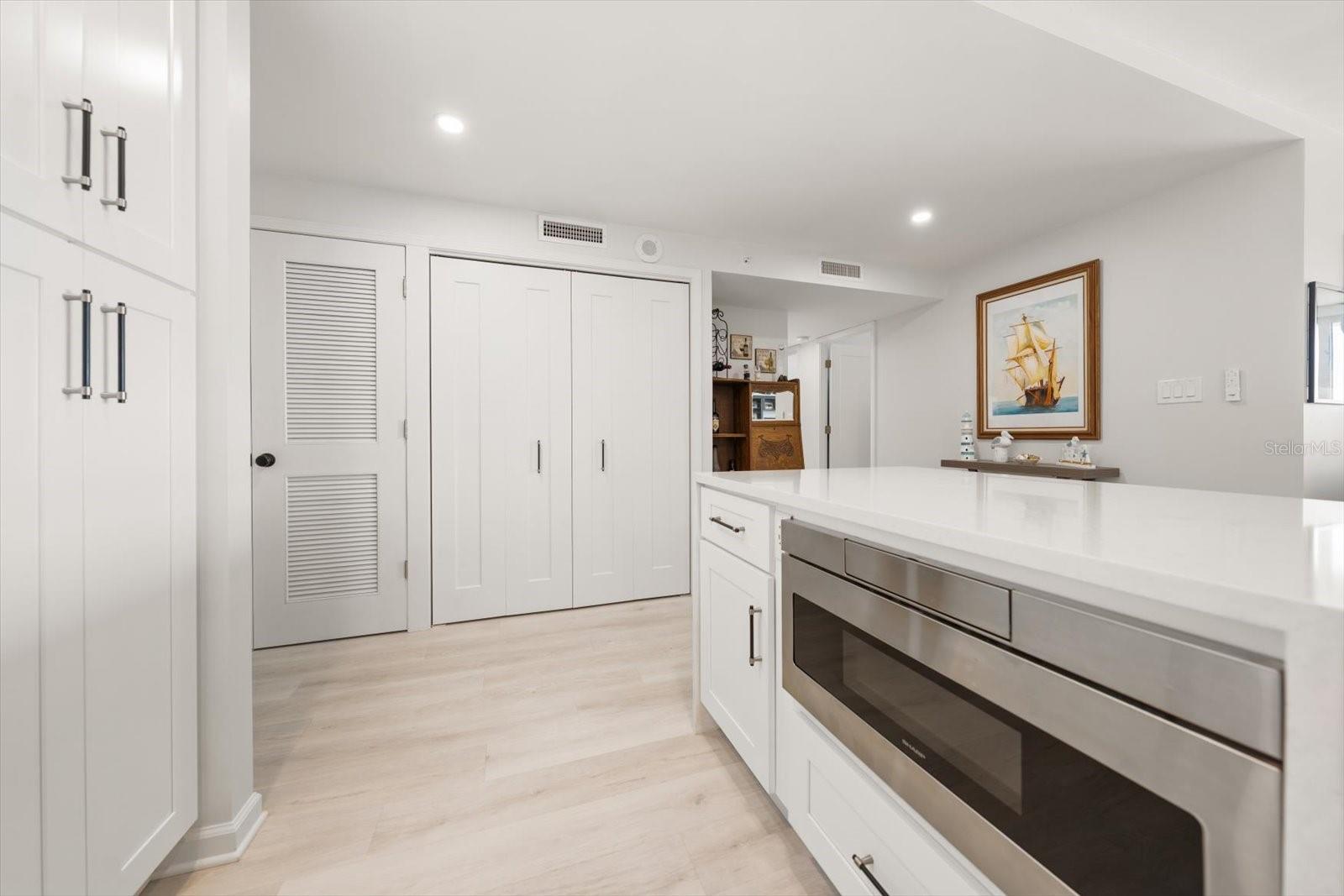 Built in microwave in kitchen island to efficiently free up cabinet & counter space.