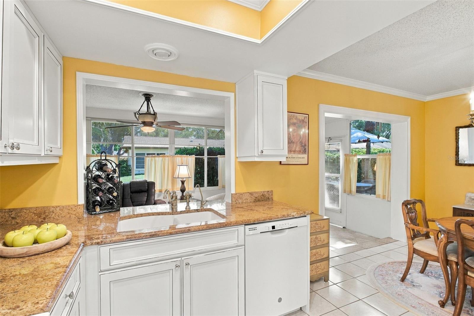 Convenient pass-through window to the Florida room making entertaining a breeze~