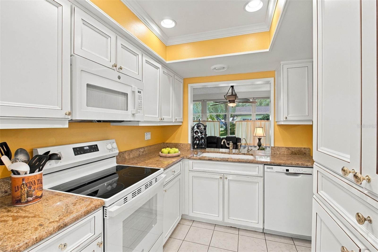 Beautiful granite countertops, newer appliances, & abundant cabinetry for stoarge~