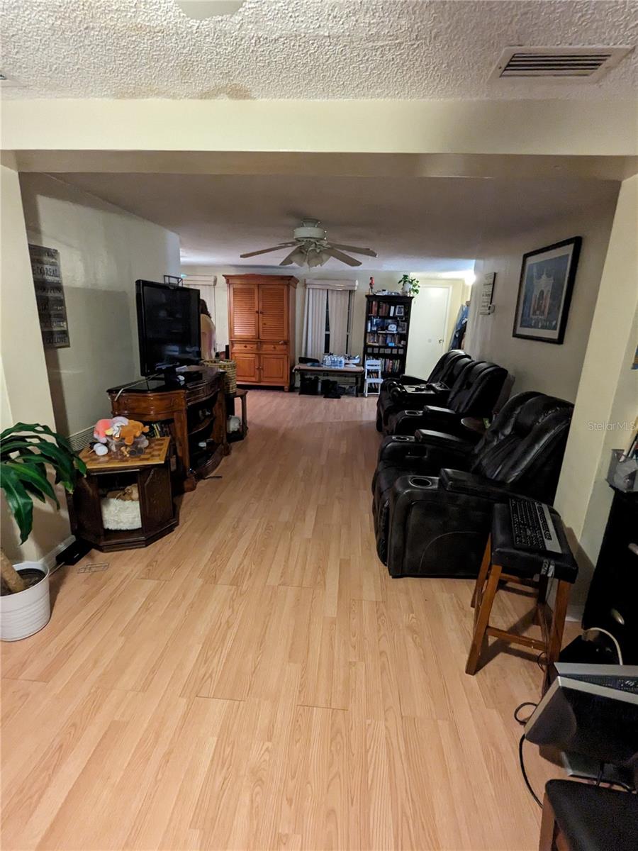 VIEW FROM LIVING ROOM EXTENSION THRU TO FRONT WINDOWS OF HOME