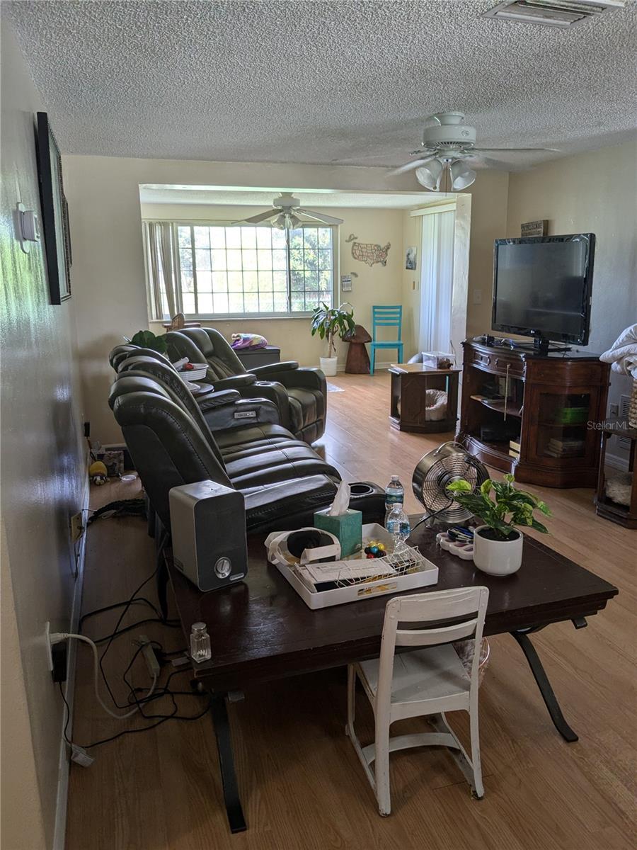 LARGE LIVING ROOM IN FOREGROUND WITH EXTENSION TO OFFICE/3RD BEDROOM