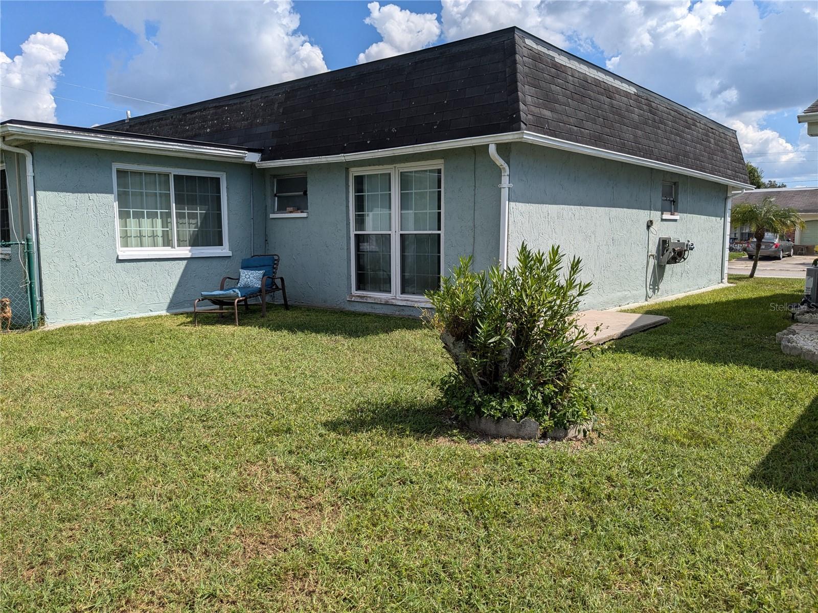 LEFT REAR OF HOUSE AND YARD