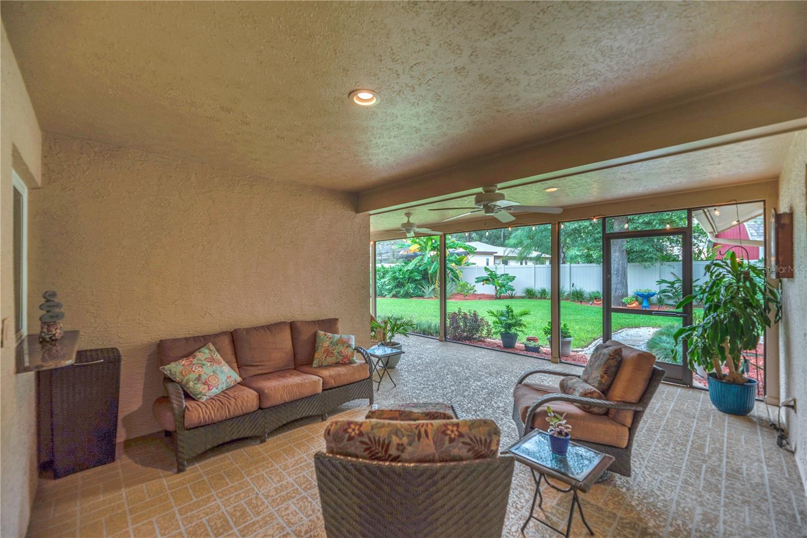 The back patio offers plenty of overhead protection from sudden downpours and protection from direct sunlight.
