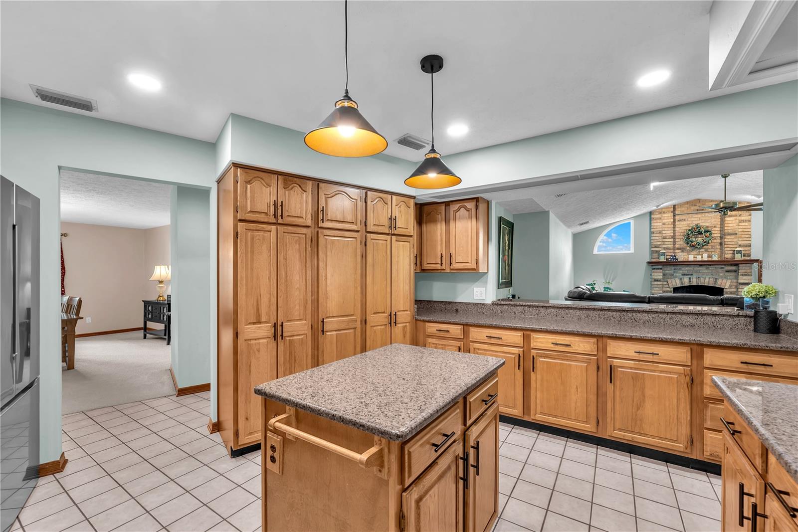 The kitchen has a breakfast bar connection to the family room to keep the conversations flowing.