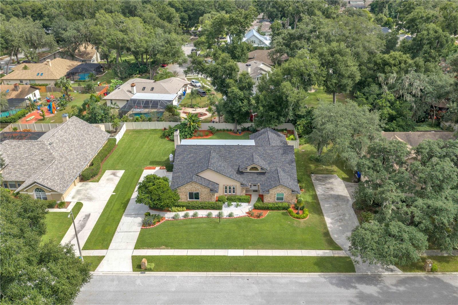 Nestled along a picturesque, tree-lined street surrounded by generously sized homesites, this stunning brick residence offers a rare combination of custom architecture and rich traditional details.