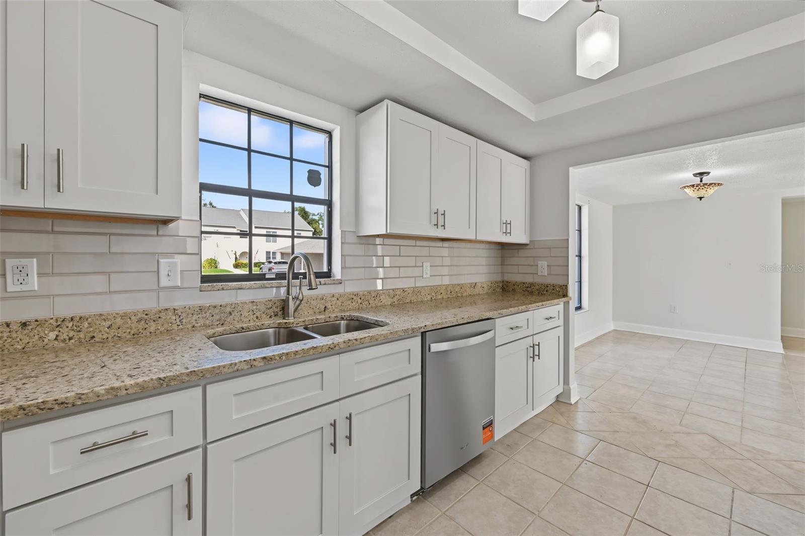 The Kitchen leads to the Dining Area