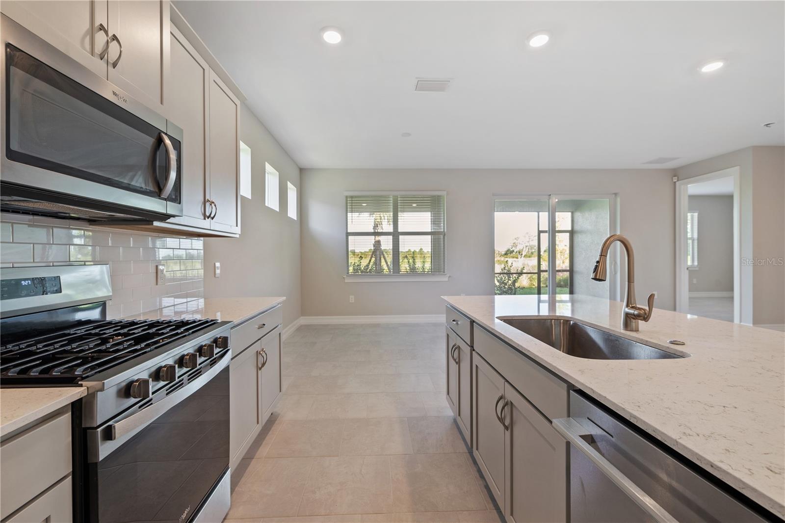 Kitchen Island with dishwasher and sink.