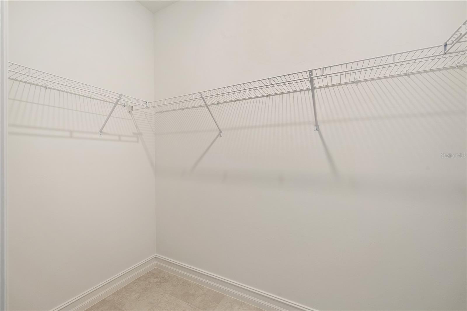 Two walk-in closets in Primary Bedroom