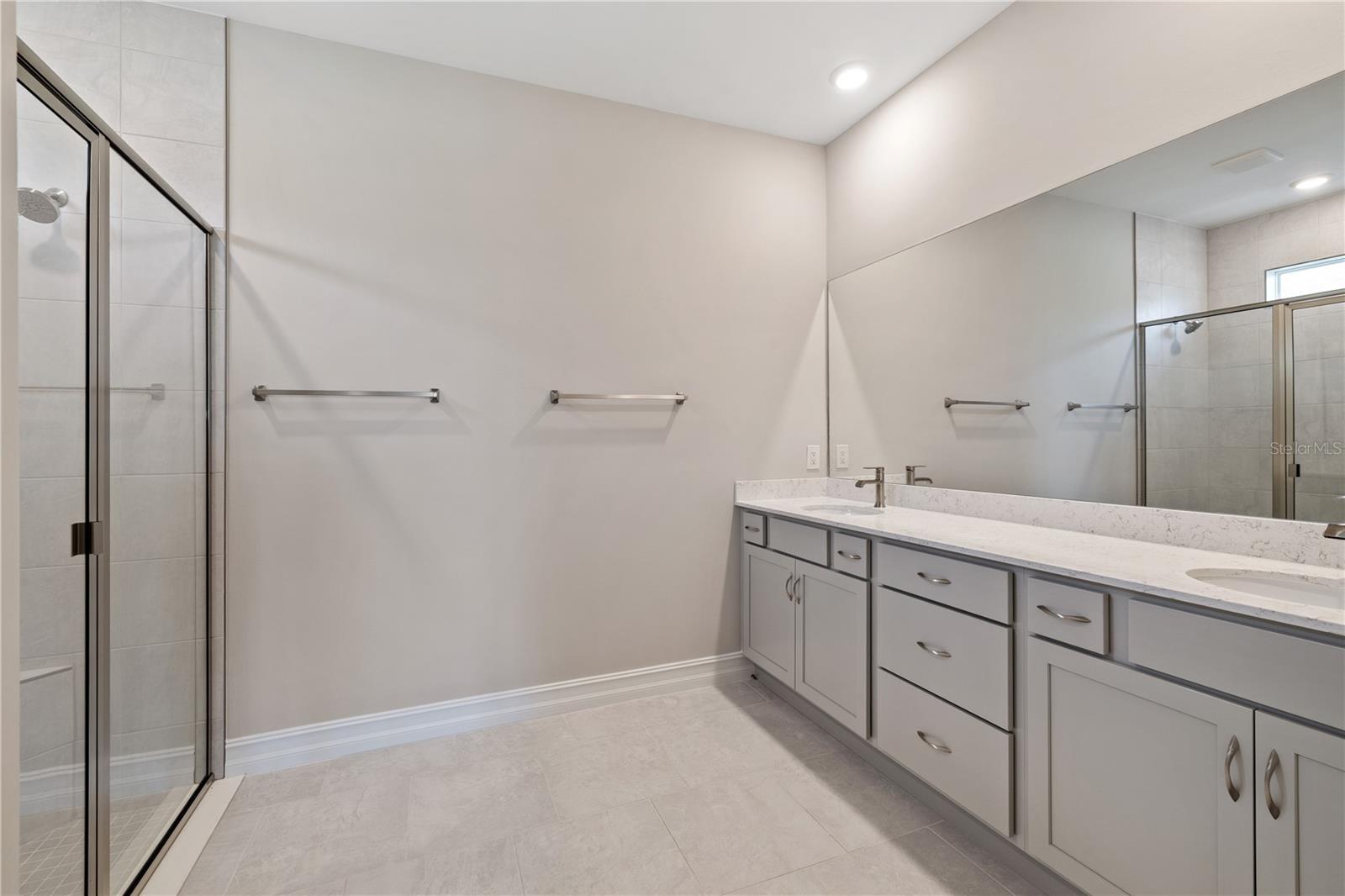 Primary bathroom with two sinks.
