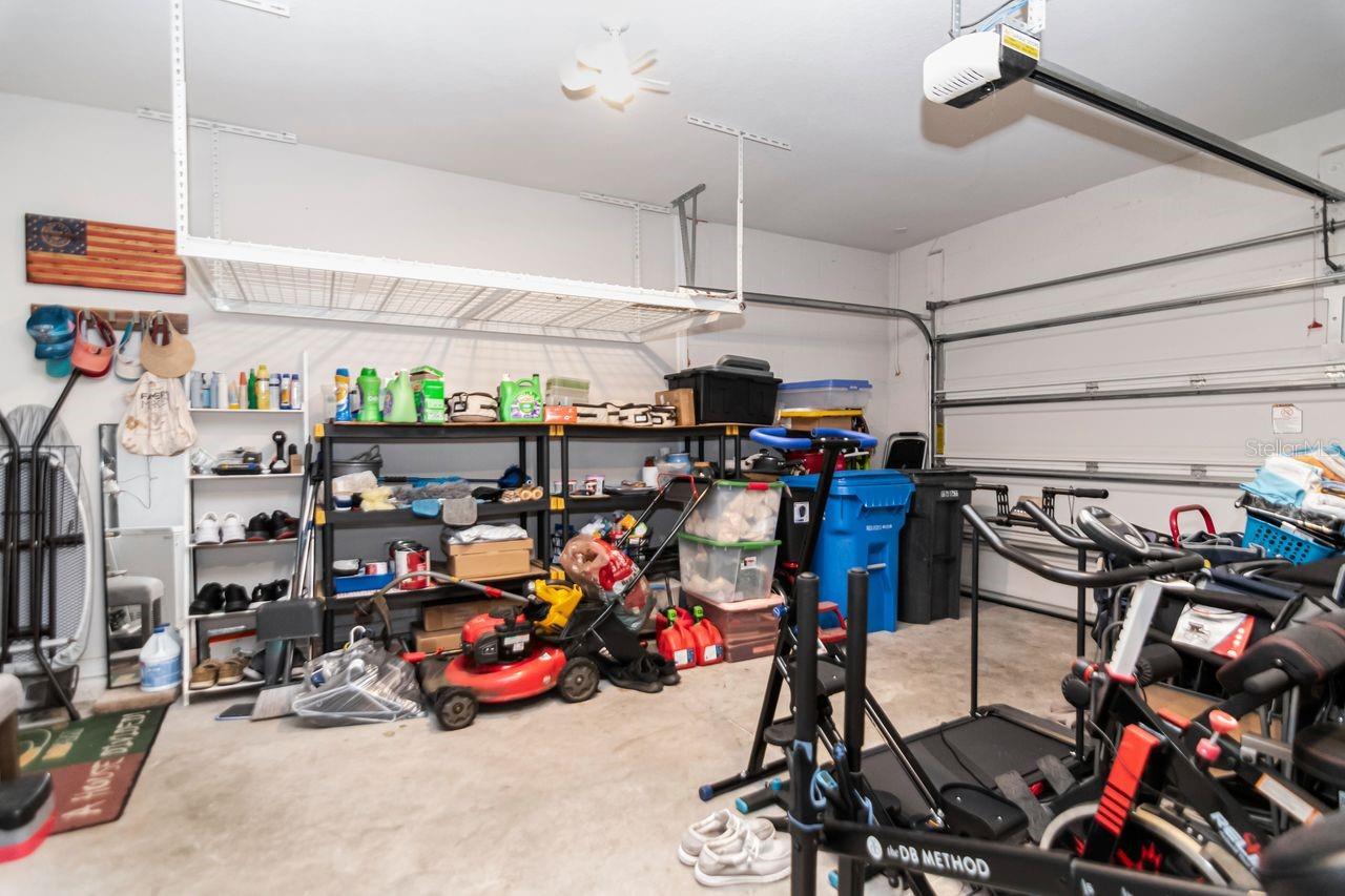 Enclosed Garage with 2 hanging storage racks