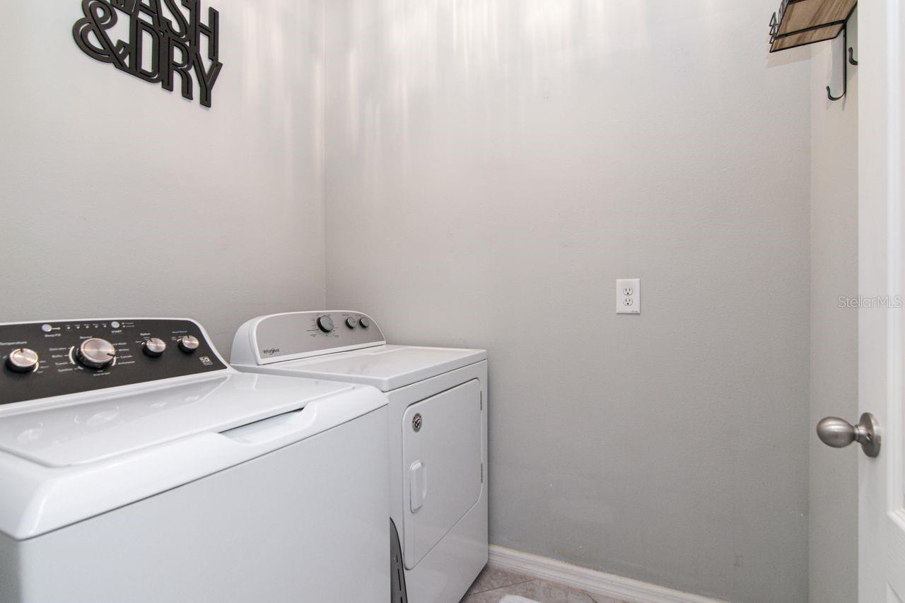 Separate Laundry room has small shelf