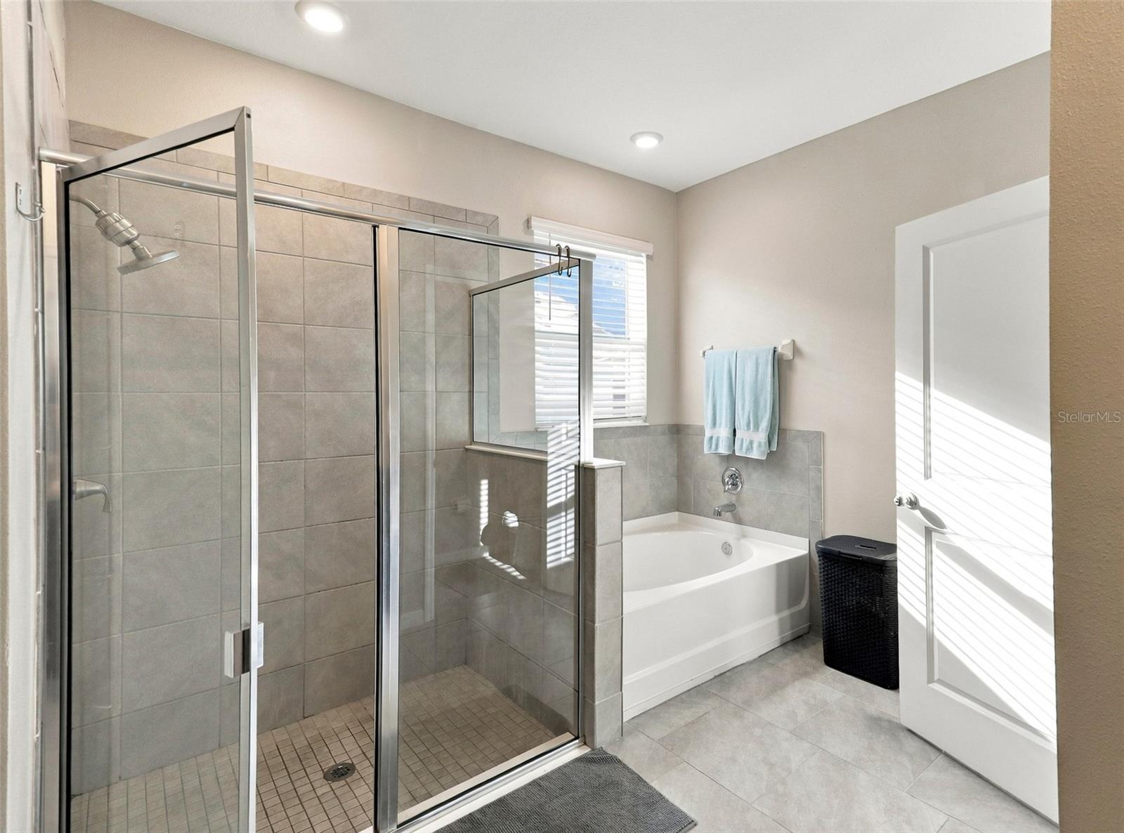 Primary Bathroom Featuring Glass-Enclosed Walk-In Shower
