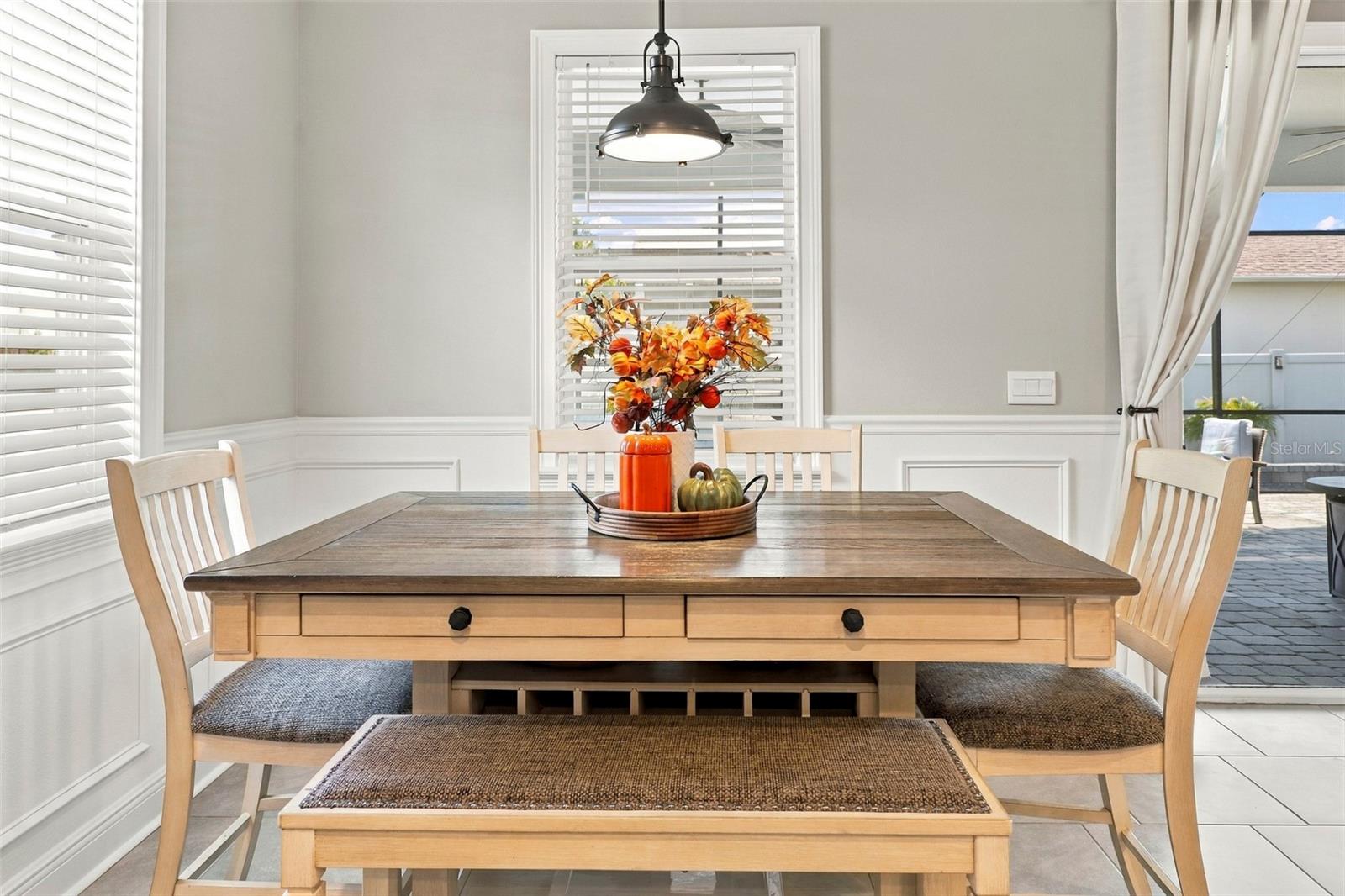 Charming Dining Area with Decorative Pendant Lighting