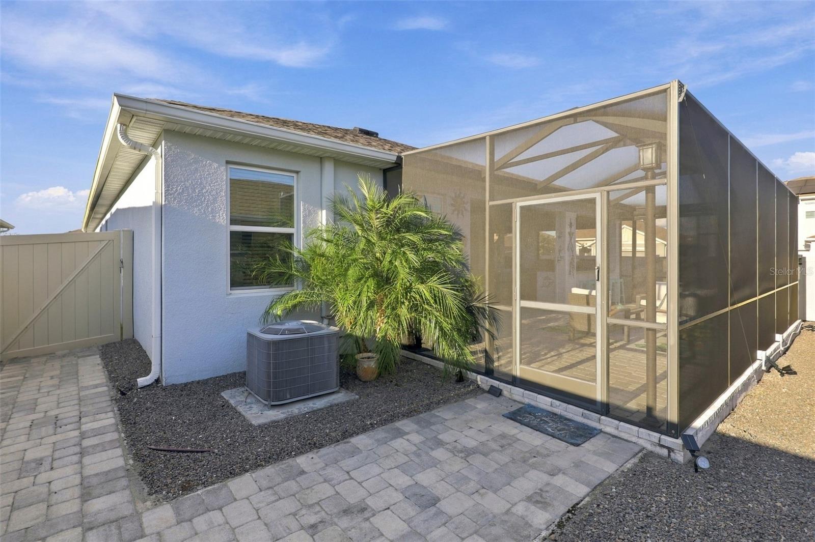 Expansive Screen-Enclosed Patio with Outdoor Entertaining Space