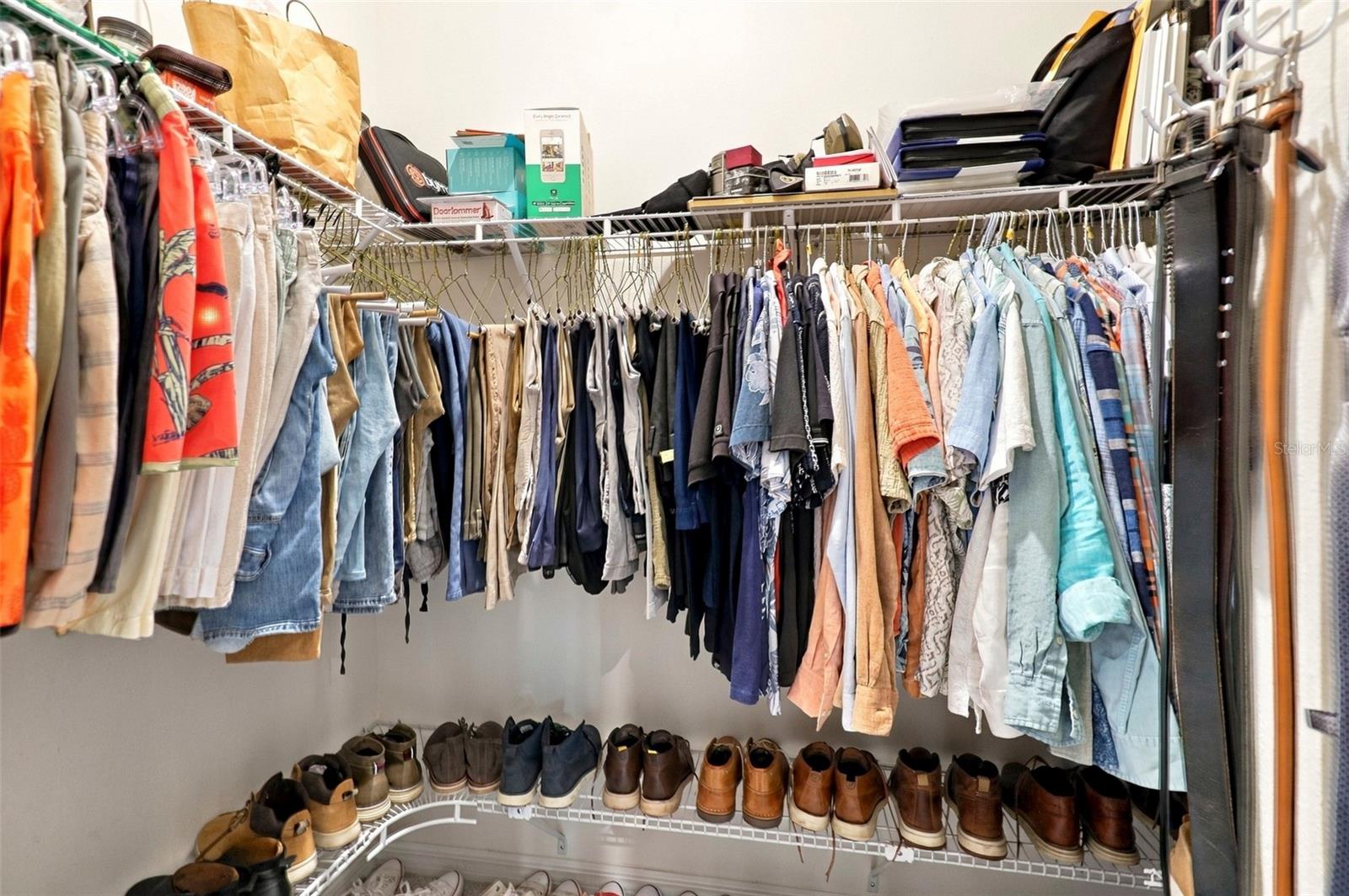 Spacious Walk-In Closet For Him with Built-In Shelving